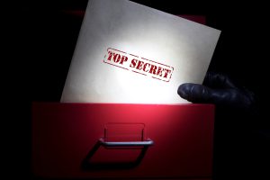 Looking for top secret documents in a dark.
